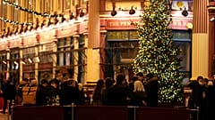 Customers drink outside a bar in London, Friday, Dec. 17, 2021. 