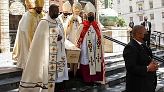 Pallbearers carry the casket holding the body of Archbishop Desmond Tutu after the funeral service in St. George's Cathedral in Cape Town, South Africa, Jan. 1, 2022