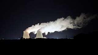 Steam escapes at night from the nuclear plant of Nogent-sur-Seine, 110 kms (63 miles) south east of Paris, Aug. 8, 2021. 