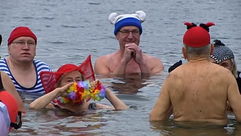 People wading into lake