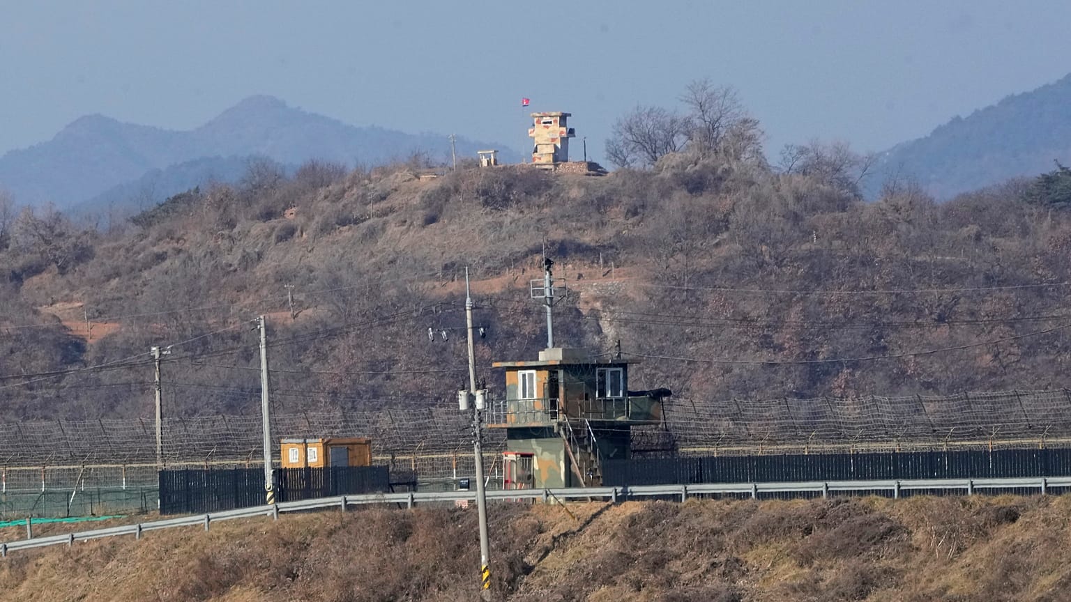 Military guard posts of North Korea, rear, and South Korea, front, are seen in Paju, near the border with North Korea, South Korea, Jan. 2, 2022.