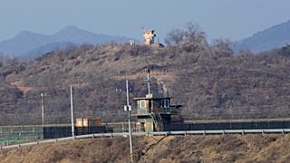 Military guard posts of North Korea, rear, and South Korea, front, are seen in Paju, near the border with North Korea, South Korea, Jan. 2, 2022.