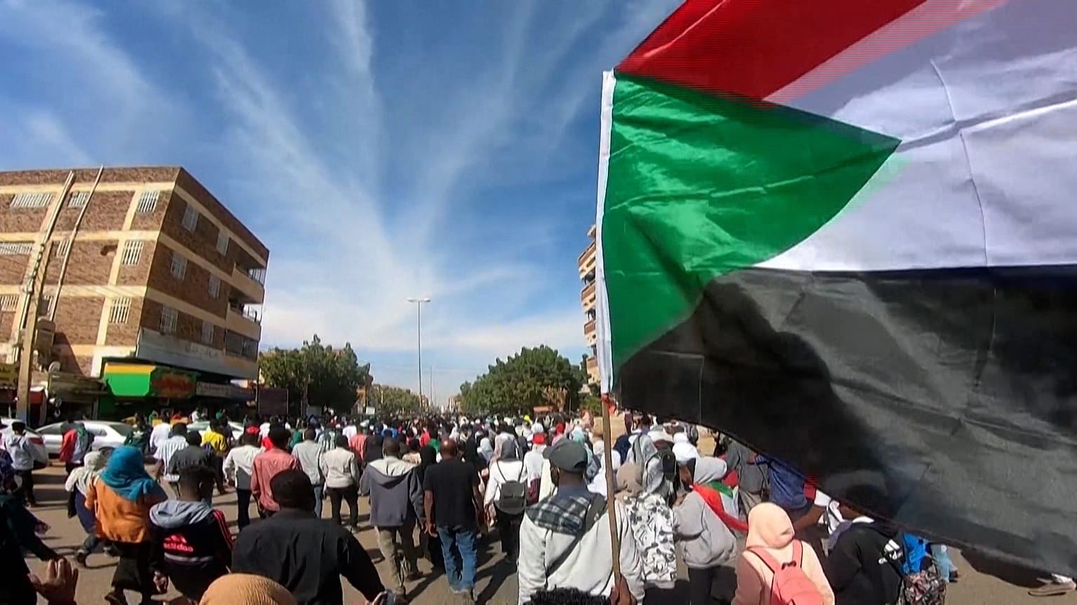 Sudanese demonstrators taking to the streets in the capital Khartoum to protest against military rule.