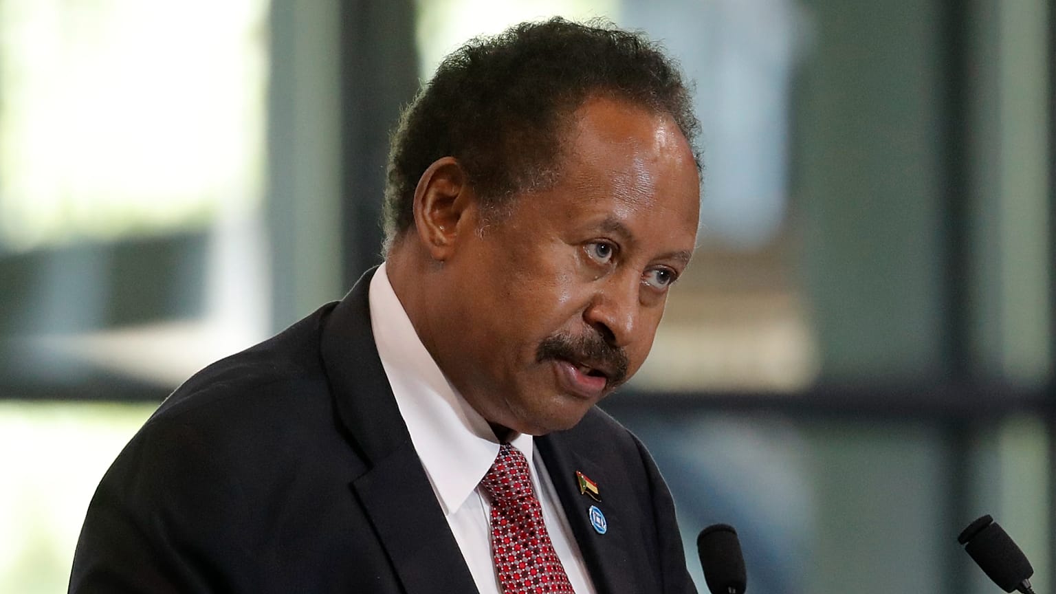 Sudanese Prime Minister Abdalla Hamdok speaks during a session of the summit to support Sudan, at the Grand Palais Ephemere in Paris on May 17, 2021.