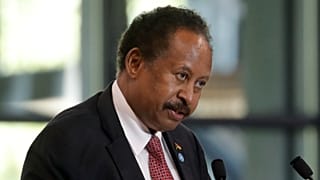 Sudanese Prime Minister Abdalla Hamdok speaks during a session of the summit to support Sudan, at the Grand Palais Ephemere in Paris on May 17, 2021.