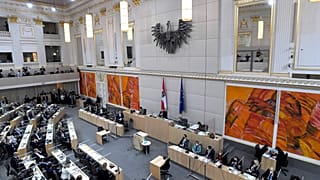 A general view shows parliamentarians attending a session of the National Council at the alternative quarter at the Hofburg in Vienna on April 21, 2021.