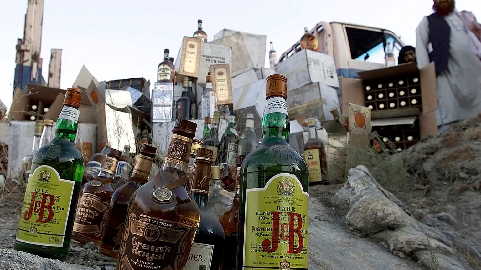 Booze bottles are piled up on rock to be smashed by Taliban authorites in Kabul, Afghanistan, Tuesday, Aug.28, 2001.