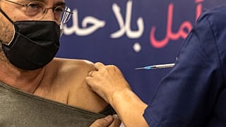 An Israeli patient receives a fourth dose of the Pfizer-BioNTech COVID-19 vaccine at the Sheba Medical Center in Ramat Gan.