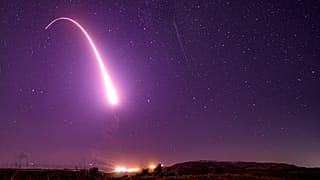 This image taken with a slow shutter speed on Oct. 2, 2019, and provided by the US Air Force shows an unarmed Minuteman 3 intercontinental ballistic missile test launch.