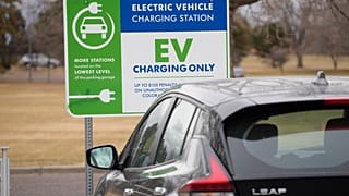 A Nissan Leaf charges at a recharge station outside the Denver Museum of Nature and Science Friday, Dec. 24, 2021.