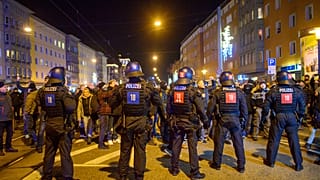 Police officers block protesters on Monday evening in the city centre of Magdeburg.