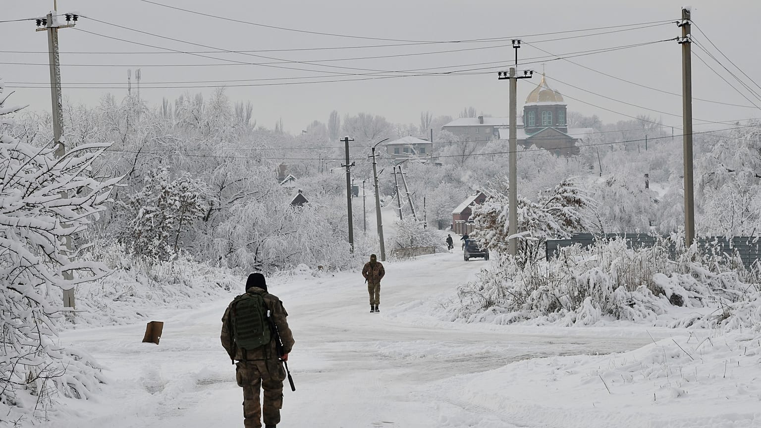 Ukrainian servicemen patrol Verkhnotoretske village near the frontline with Russia-backed separatists in the Yasynuvata district of Donetsk region.