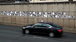Posters read "Delphine, 33, strangled by her husband Reanud. Their four children were present. 115th feminicide" in Paris, Wednesday, Nov. 6, 2019.
