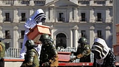 Beekeepers who demanded government measures to face the persistent drought take part in a protest with honeycombs full of bees in front of Chilean Presidential Palace