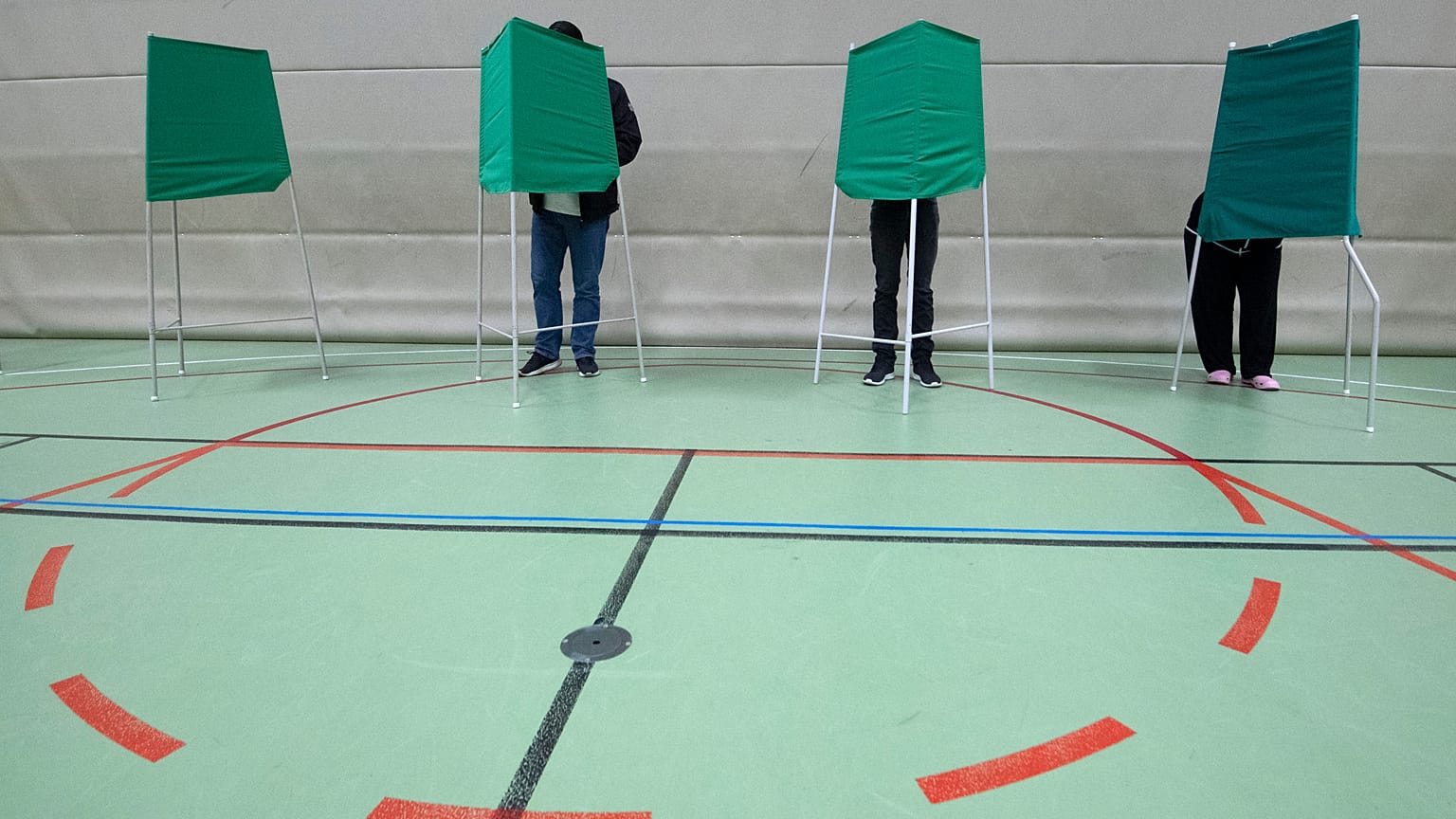 People vote at a polling station during the European Parliament elections in Lund, Sweden.