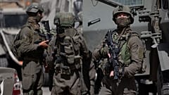 جنود إسرائيليون يبحثون عن مسلحين فلسطينيين مشتبه بهم في قرية عقربا بالقرب من مدينة نابلس بالضفة الغربية