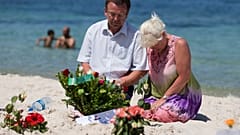 Mourners on the site of the 2015 terror attack on a beach in Tunisia.