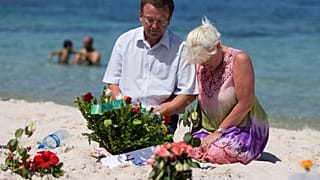 Mourners on the site of the 2015 terror attack on a beach in Tunisia.