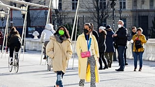 People walk on a street in Vienna, Austria
