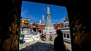 Tourists visit Grand Palace in Bangkok, Thailand.