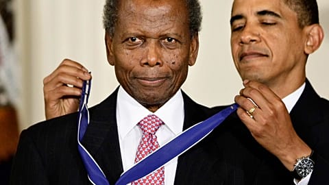 President Barack Obama presents the 2009 Presidential Medal of Freedom to Sidney Poitier during ceremonies in the East Room at the White House in Washington on, Aug. 12, 2009
