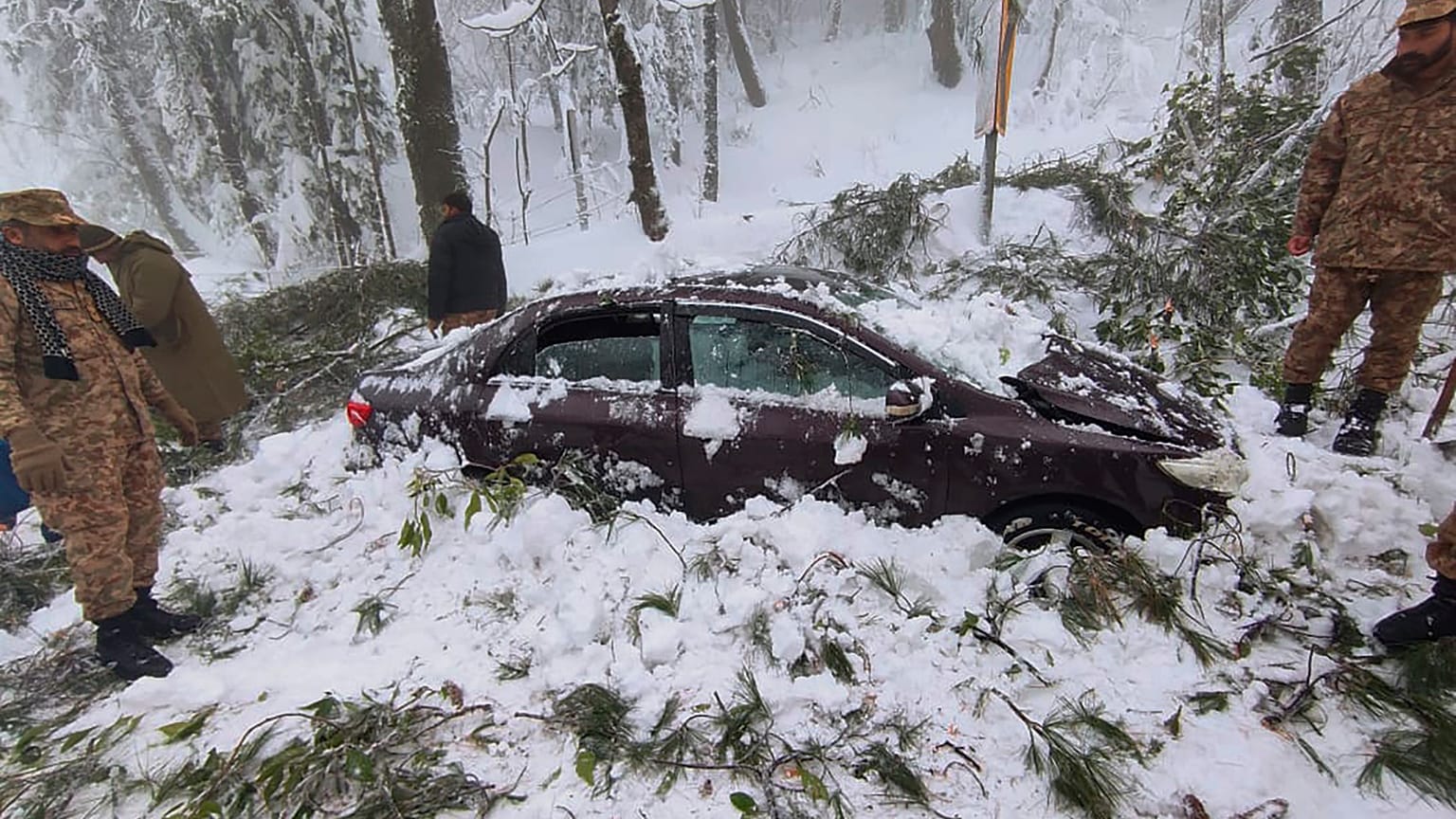Army troops take part in rescue operation in a heavy snowfall-hit area in Murree, some 45 kilometres north of the capital of Islamabad, Pakistan.