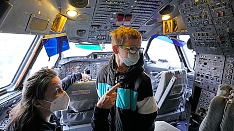9-year old Niklas gets a view into the cockpit after he was vaccinated inside an Airbus A300 Zero G plane.