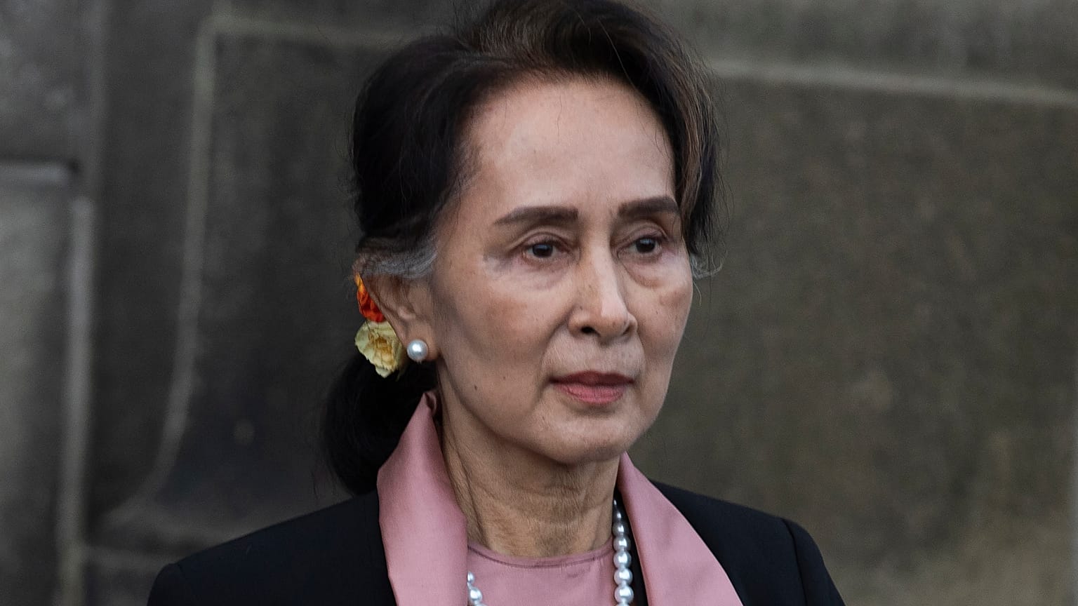  Myanmar's leader Aung San Suu Kyi leaves the International Court of Justice after the first day of three days of hearings in The Hague, Netherlands, on Dec. 10, 2019. 