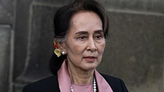 Myanmar's leader Aung San Suu Kyi leaves the International Court of Justice after the first day of three days of hearings in The Hague, Netherlands, on Dec. 10, 2019.