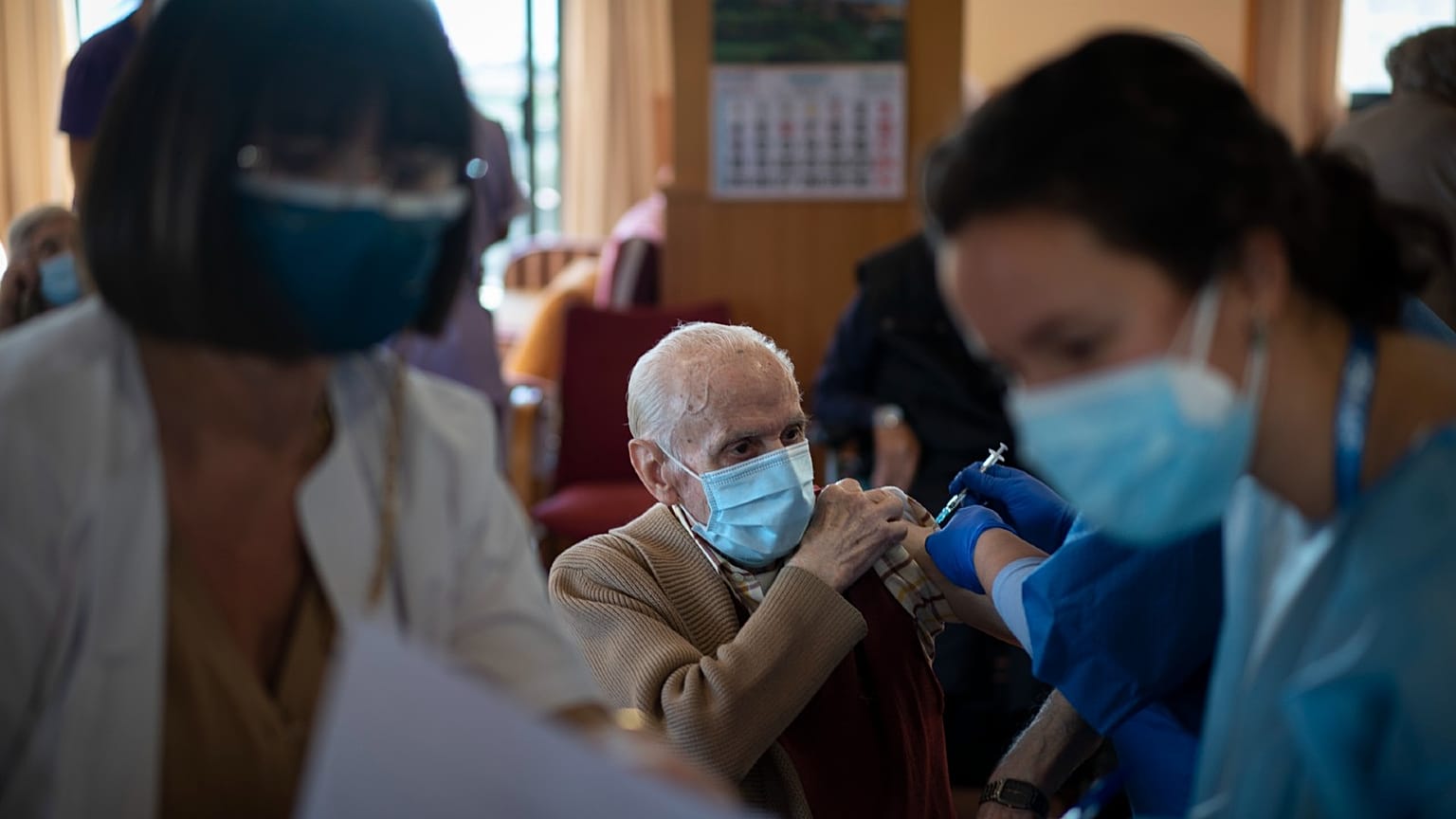 A nurse administers the Pfizer-BioNTech Covid vaccine.