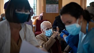 A nurse administers the Pfizer-BioNTech Covid vaccine.