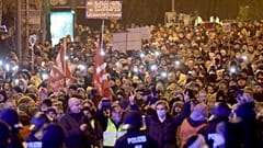 Protestors attend a demonstration against coronavirus restrictions and compulsory vaccinations, in Lubeck, Germany, on Jan. 10, 2022.