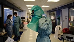 A member of the medical team wearing PPE in the ICU department of the Clinica Universitaria in Pamplona.