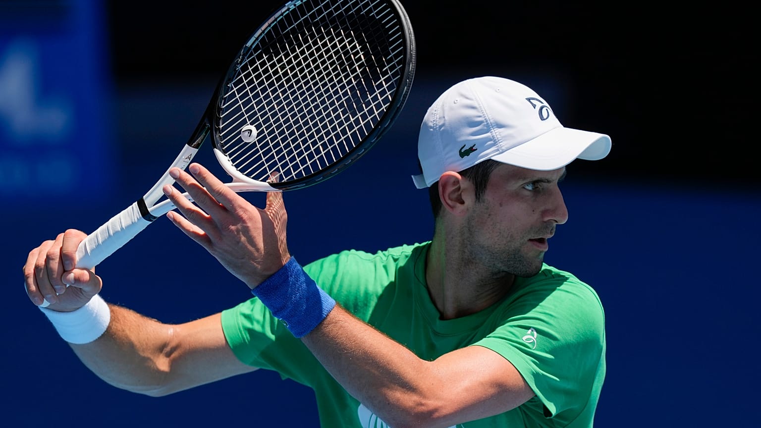 Defending men's champion Serbia's Novak Djokovic practices on Margaret Court Arena ahead of the Australian Open tennis championship in Melbourne, Australia, Jan. 13, 2022.