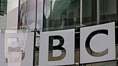 In this Thursday, March 28, 2013 file photo, people look out from inside BBC's New Broadcasting House, in central London