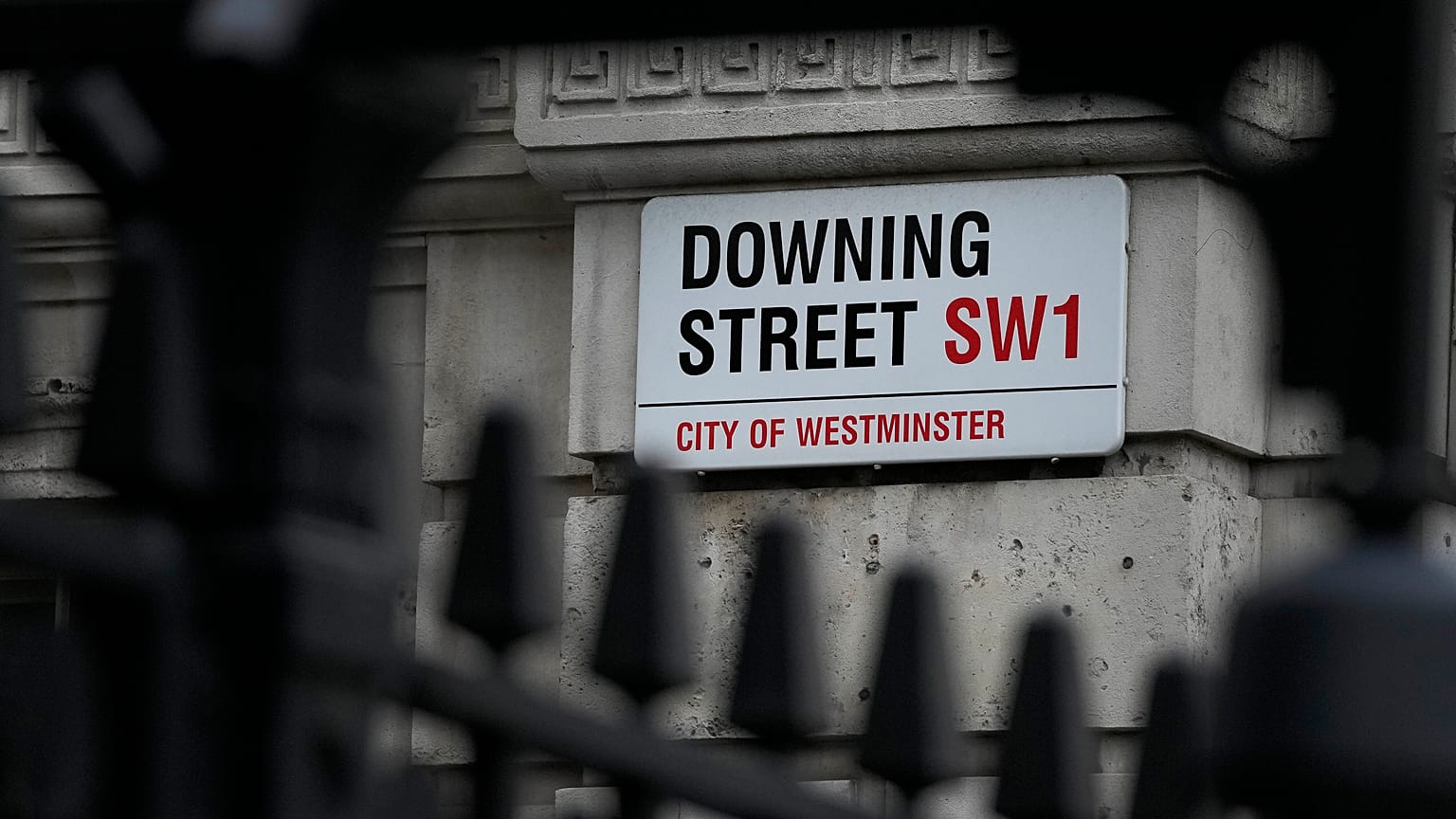 A Downing Street sign is fixed at the entrance in London, Tuesday, Jan. 11, 2022. 