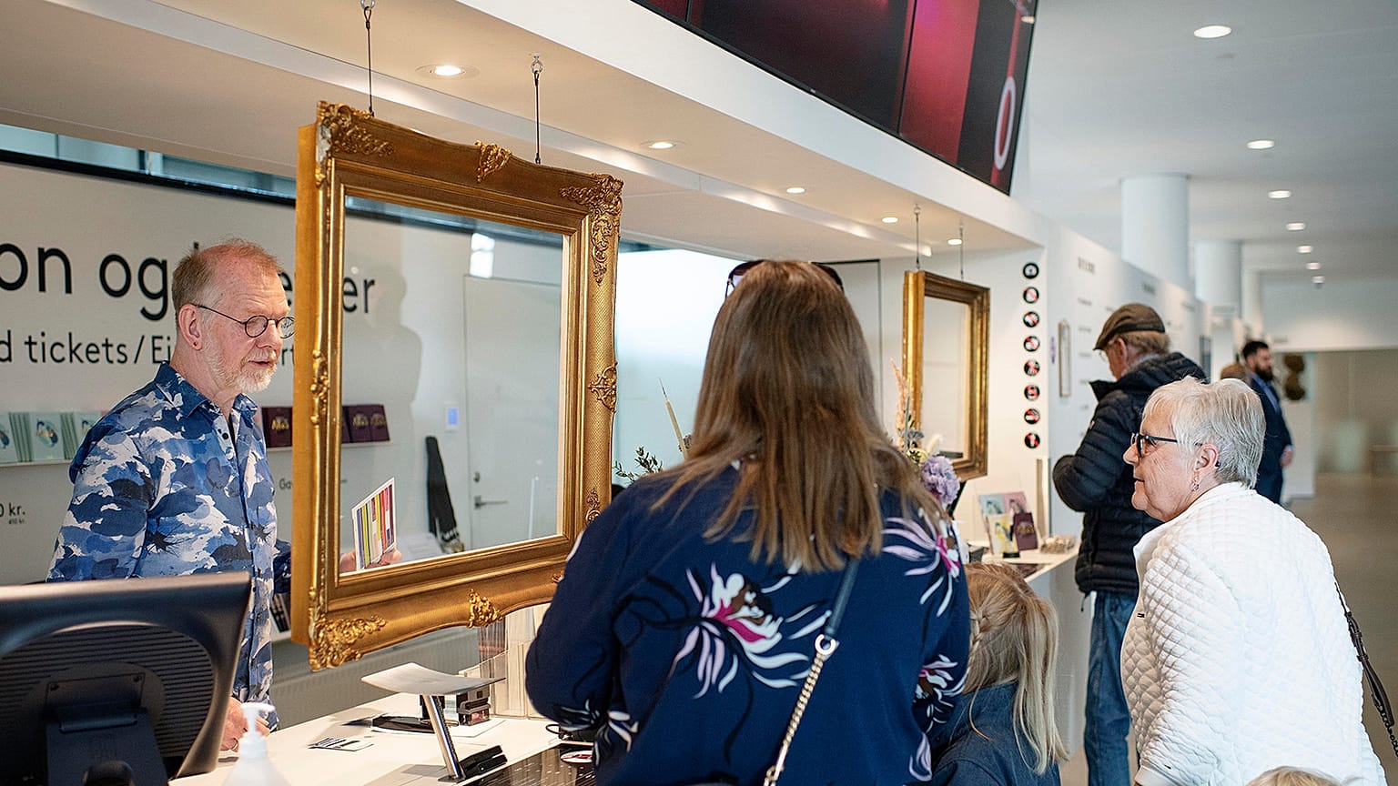 Poeple queue to enter the art museum ARoS, in Aarhus, Denmark