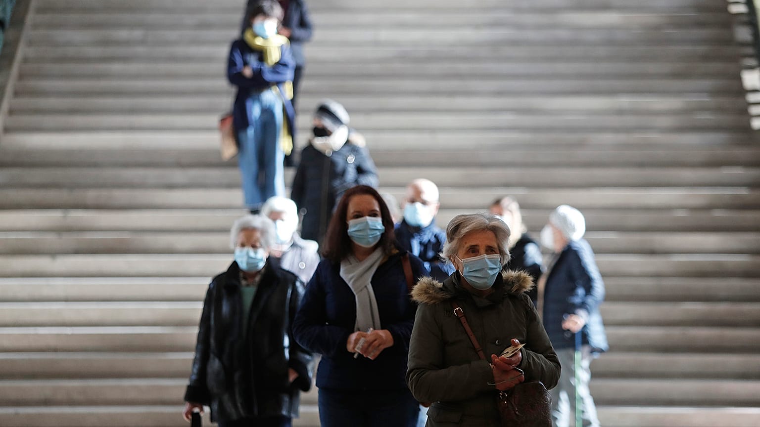 People queue to vote at a polling station at the University of Lisbon, Sunday, January 24
