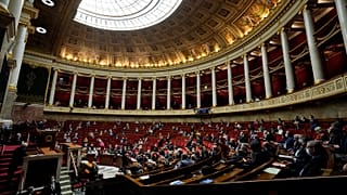 Parliament members attend a session of questions to the Government at the French National Assembly in Paris