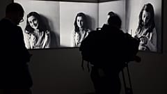 FILE- Journalist takes images of pictures of Anne Frank at the renovated Anne Frank House Museum in Amsterdam, Netherlands, Wednesday, Nov. 21, 2018. 