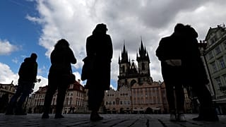 People observe a minute of silence to commemorate the anniversary of the death of the first Czech COVID-19 patient.