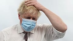 Britain's Prime Minister Boris Johnson gestures during a visit to Finchley Memorial Hospital, in North London, Jan. 18, 2022. 