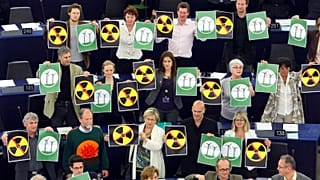 Green parties members of the European Parliament protest with anti-nuclear posters