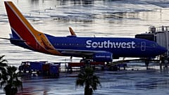 Woman sues Southwest, says airline ejected her for removing mask to drink water