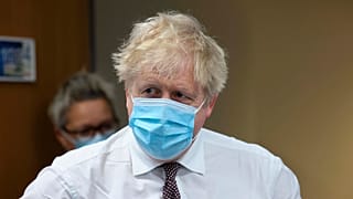Britain's Prime Minister Boris Johnson looks on during a visit to Finchley Memorial Hospital, in North London, Tuesday, Jan. 18, 2022.