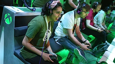 Gaming fans interact with newly-announced games at the Xbox E3 2019 Showcase in the Microsoft Theater at L.A. Live, Sunday, June 9, 2019 in Los Angeles.