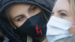 A demonstrator during a protest against alleged police brutality during recent abortion demos, in Warsaw, Poland, Saturday, Feb. 6, 2021