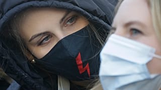 A demonstrator during a protest against alleged police brutality during recent abortion demos, in Warsaw, Poland, Saturday, Feb. 6, 2021