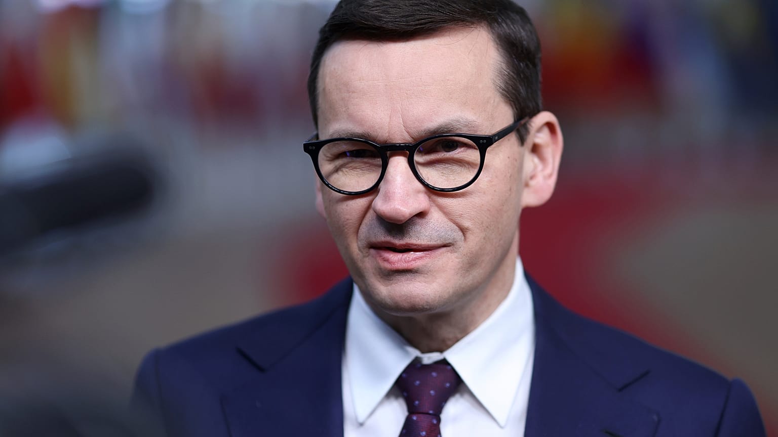 Poland's Prime Minister Mateusz Morawiecki speaks with the media as he arrives for an EU Summit at the European Council building in Brussels.