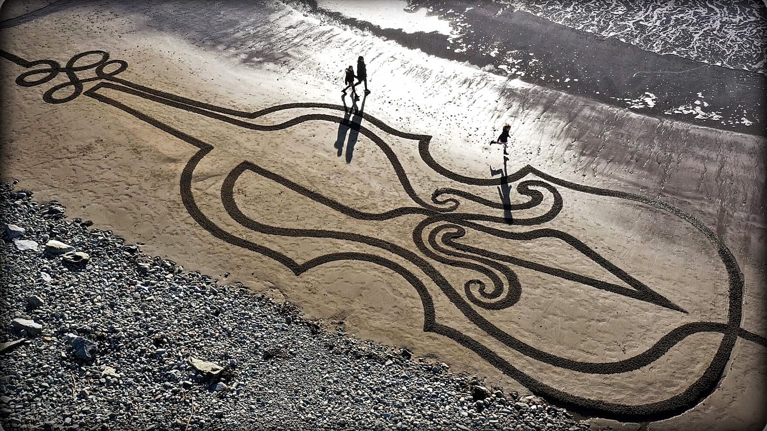 A giant sand artwork in tribute to Ashling Murphy, an Irish schoolteacher who was fatally attacked